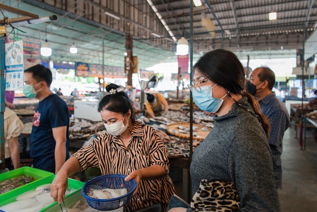 Woman shopping at Thai street food market