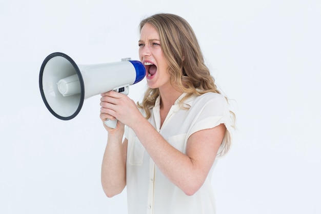 Woman shouting through a loudspeaker