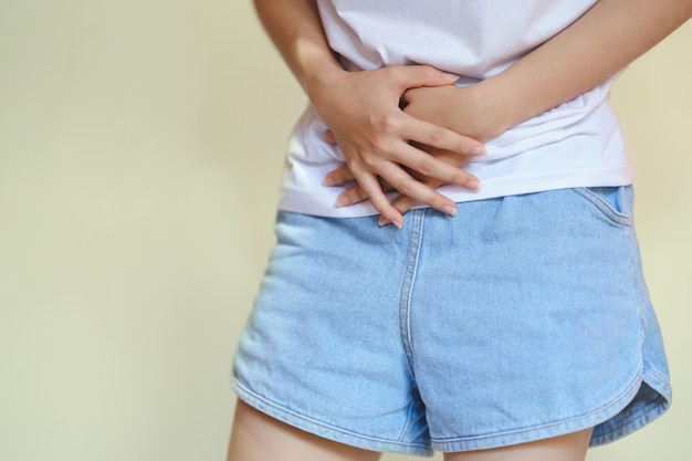 Woman showing abdominal pain lower abdominal pain menstrual pain gastritis