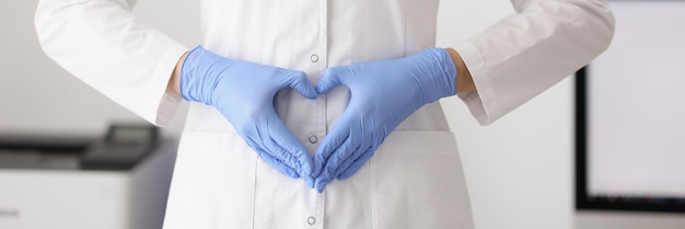 Woman showing heart sign with hands