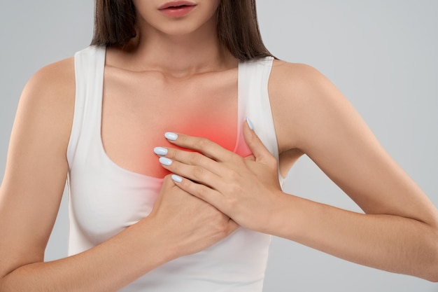 Woman showing pain in chest