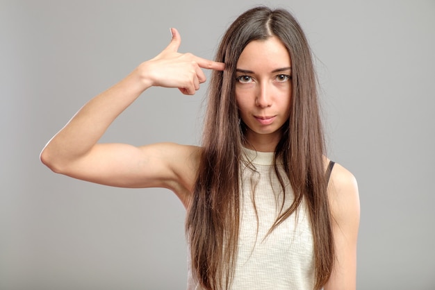 Woman showing suicide sign