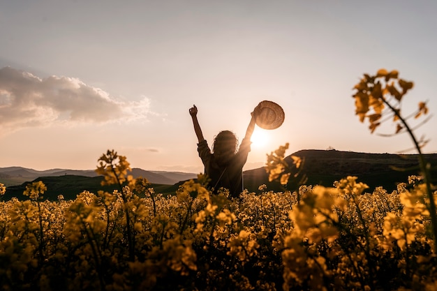  woman shows her happiness by throwing the hat