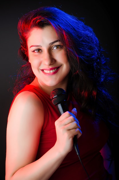 Woman singing in karaoke club