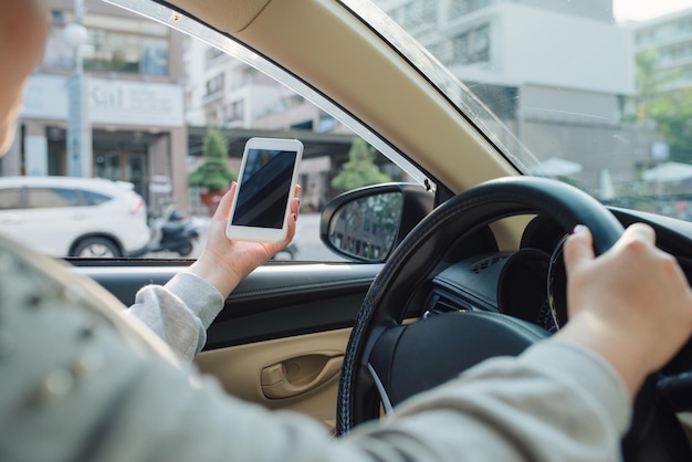 Woman sit in modern car in front of dashboard