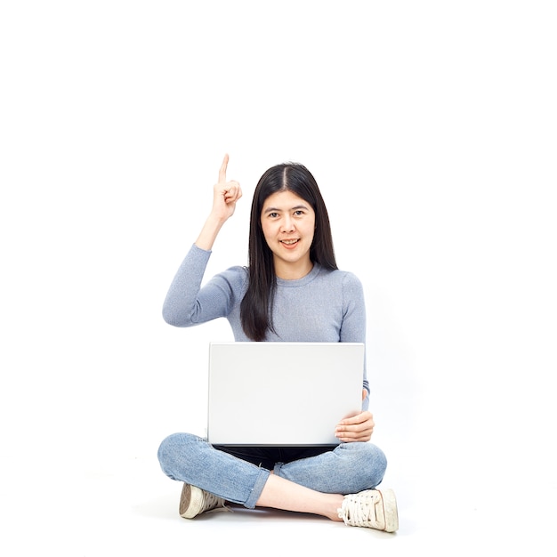 Woman sitting floor holding laptop