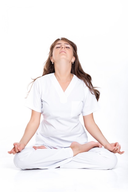 Woman sitting in the Lotus position