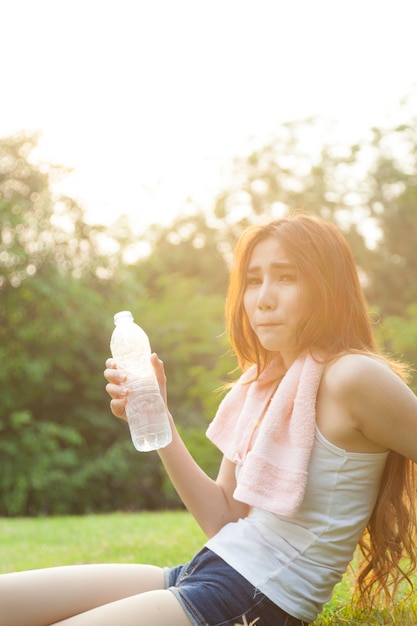 Woman sitting rest after exercise.