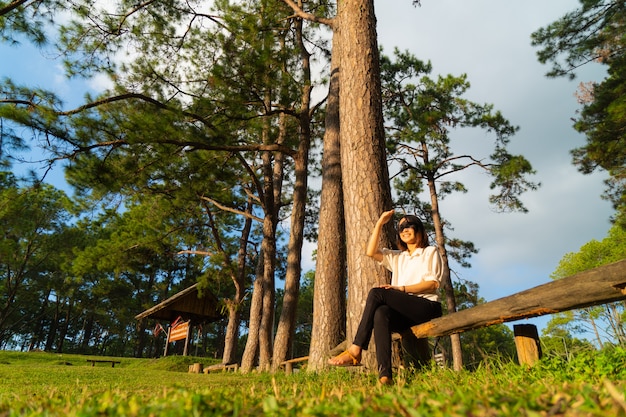 Woman sitting on a timber