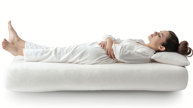 Woman sleeping peacefully on a white mattress