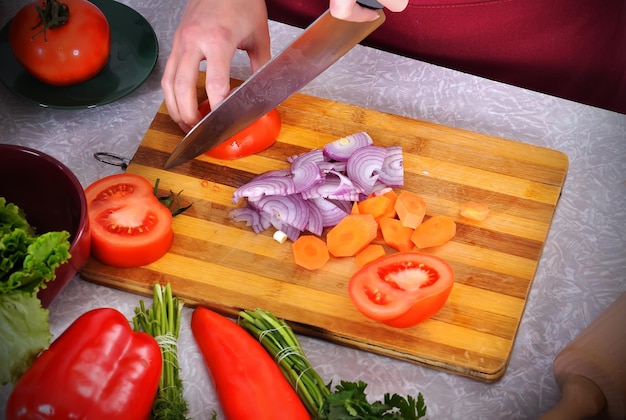 Woman slicing vegetables food