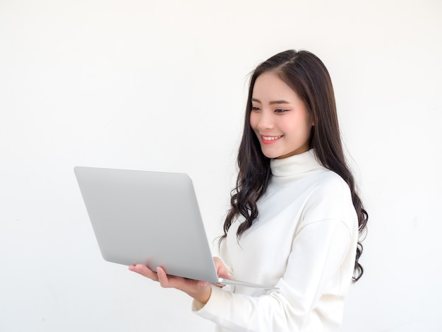 woman smiles with laptop