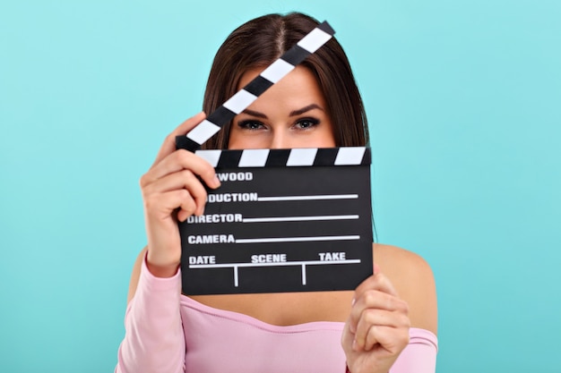 woman smiling against blue background