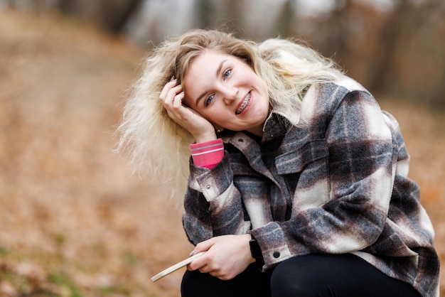 Woman Smiling at Camera With Braces