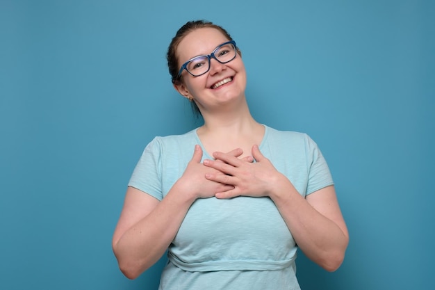 Woman smiling expressing positive emotions and feelings being pleased with compliment