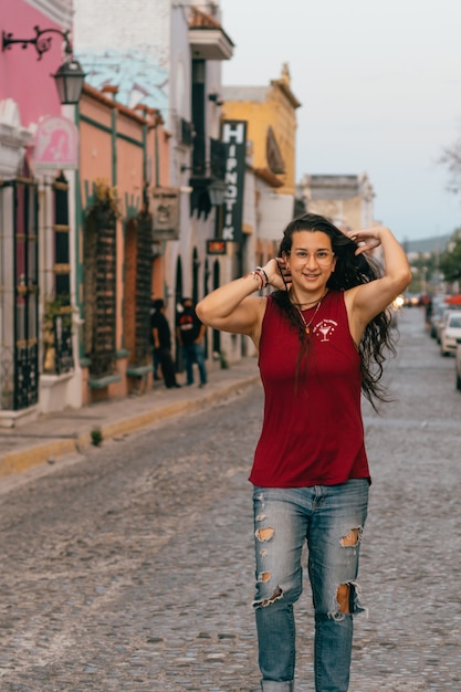 Woman smiling on the street of Magical Town.