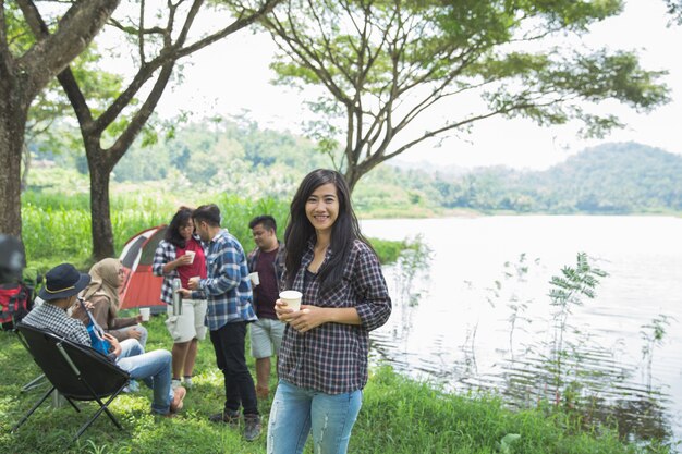 Woman smiling while camping