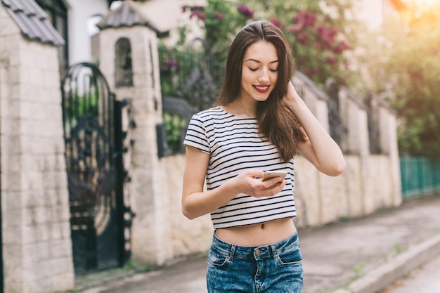 Woman smiling with her mobile 