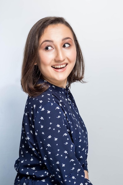 Woman smiling with perfect smile and white teeth, looking to the side, laugh.