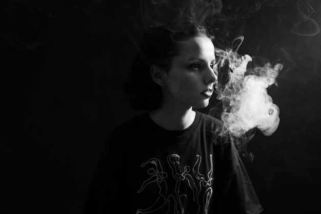 woman smokes black and white photography