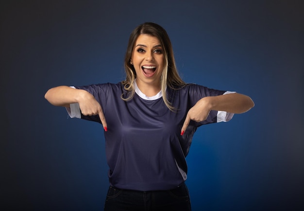 Woman soccer fan cheering for her favorite club and team world cup blue background