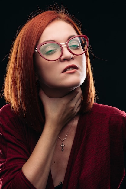 Woman in spectacles having sore throat