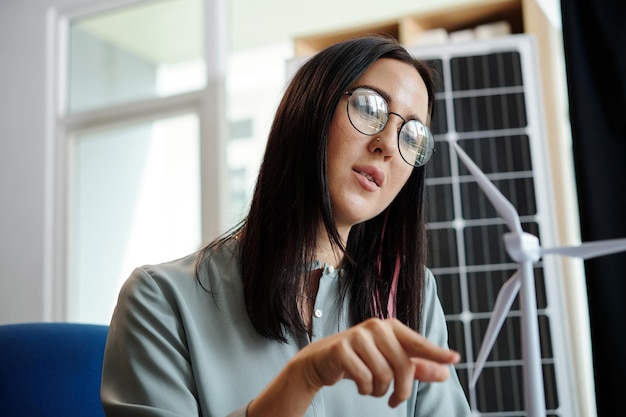 Woman Spinning Wind Turbine Blades