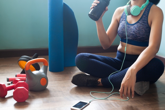 Woman in sportswear drinking protein shake, Healthy