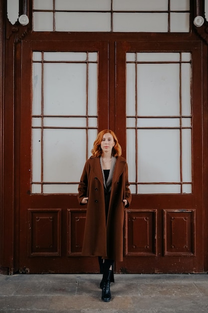 A woman standing in front of a door that says'i love you '