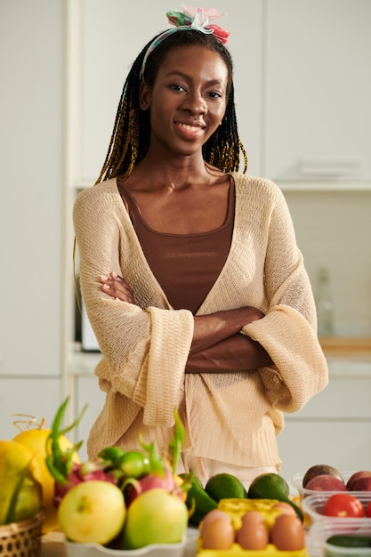 Woman Standing at Kitchen Counter