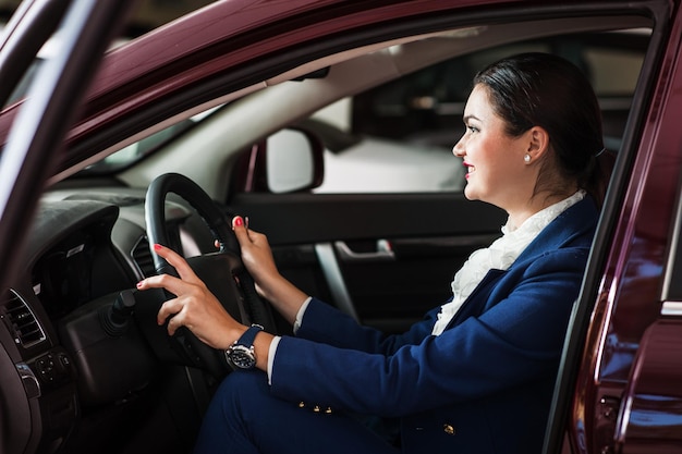 The woman the steering wheel