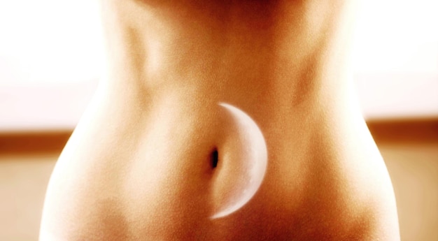 Woman stomach with moon multiple exposure Menstruation concept