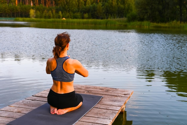 A woman stretches her muscles in nature Physical activity concept