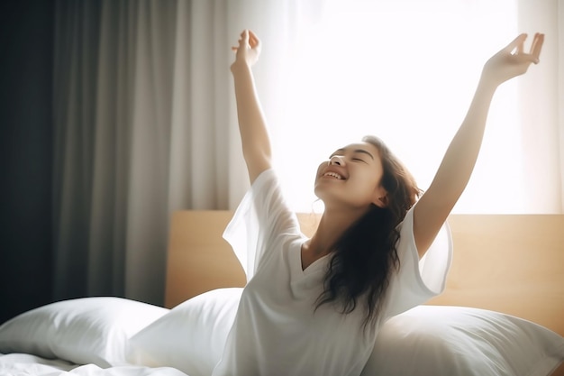 A woman stretching in bed with her arms up and her arms up.