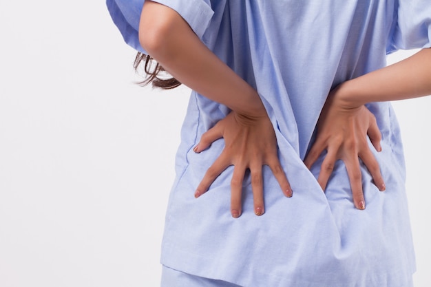 Woman suffering from back pain, backbone or spinal muscle injury