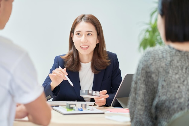 A woman in a suit who sells real estate