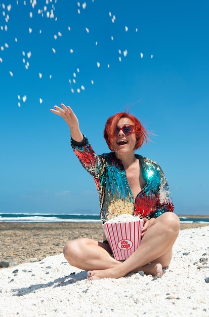 woman in the sun on the sand of Popcorn Beach in Fuerteventura