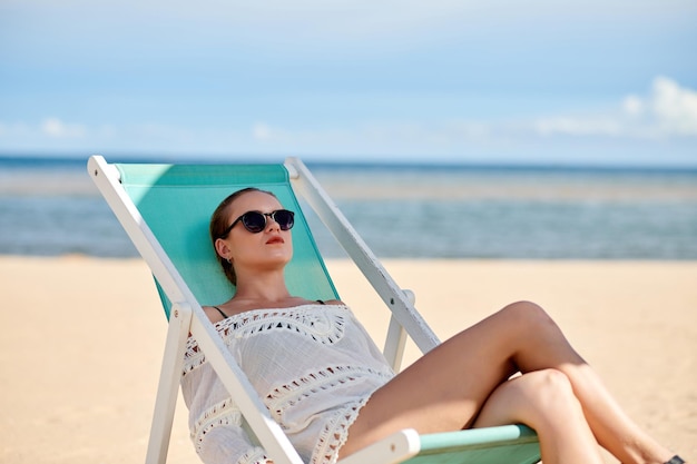 Woman sunbathing on the beach