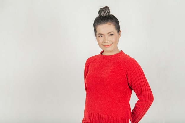 Woman and sweet smile. Thai style wearing a red shirt, stylish and healthy for women.