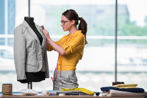 Woman tailor working on new clothing