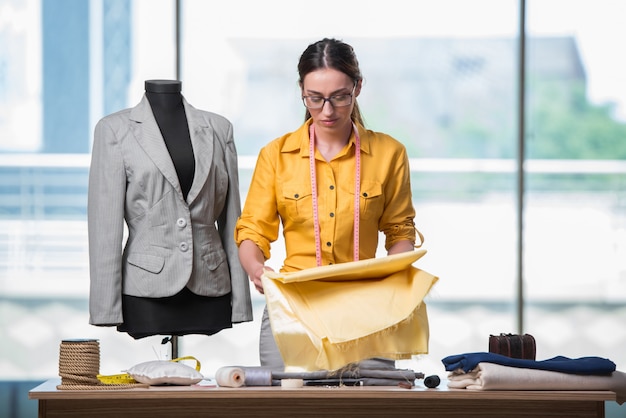 Woman tailor working on new clothing