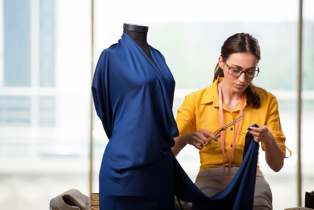 Woman tailor working on new clothing