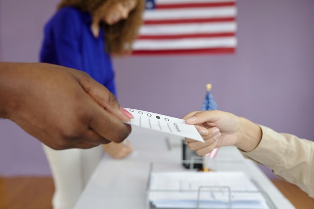 Woman Taking Bulletin To Vote