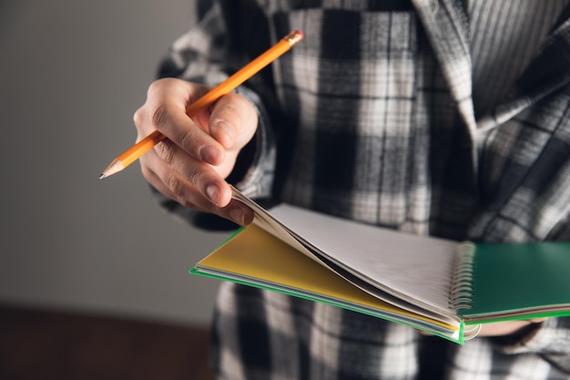 Woman taking notes in a notebook