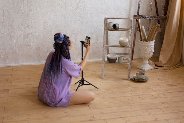 Woman taking photos for her business