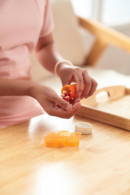 Woman taking pills in the morning