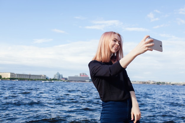 woman taking a selfie on the beach