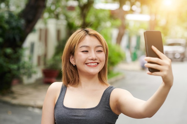 Woman Taking Selfie Outdoors