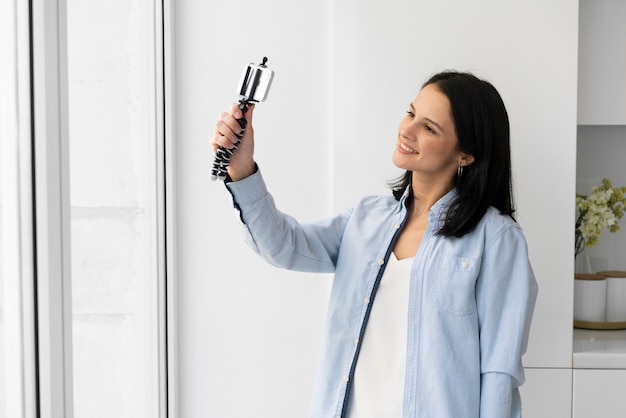 Woman taking a selfie with her phone