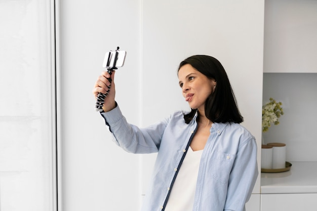 Woman taking a selfie with her phone